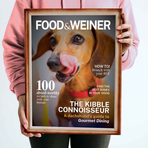 a photo of a framed example of a Miss WeinerVerse custom Food & Weiner Magazine print